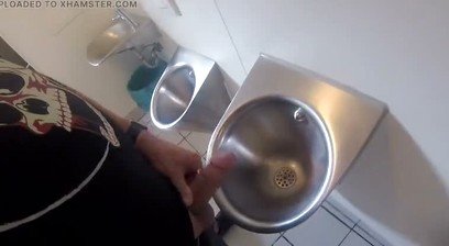 Im pissing into the urinal of a public restroom and jerking off my thick cock until Im precumming.
