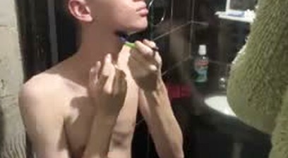 A Twink showing his body and naked at shower