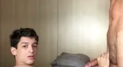 Luiz Felipe holds Pietro's large penis hoping to suck it, and Pietro eats his ass